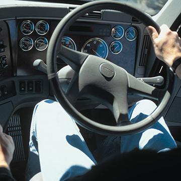 The steering wheel in a semi truck.