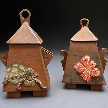Ceramic art shaped like birdhouses